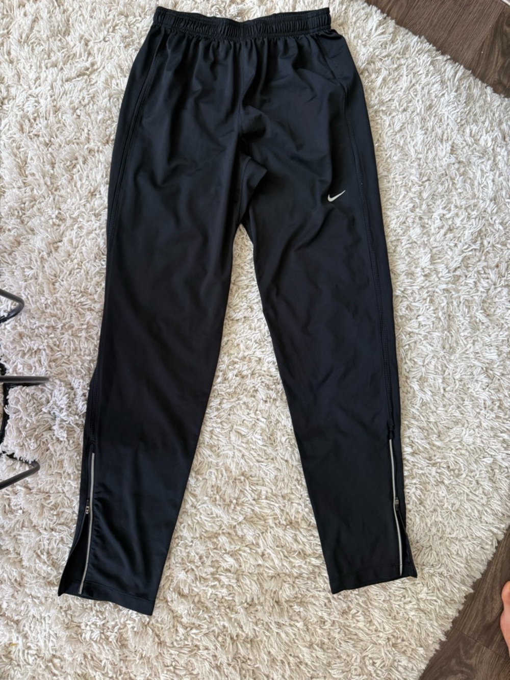 Nike Black Track Pants with White Swoosh and Ankle Zippers